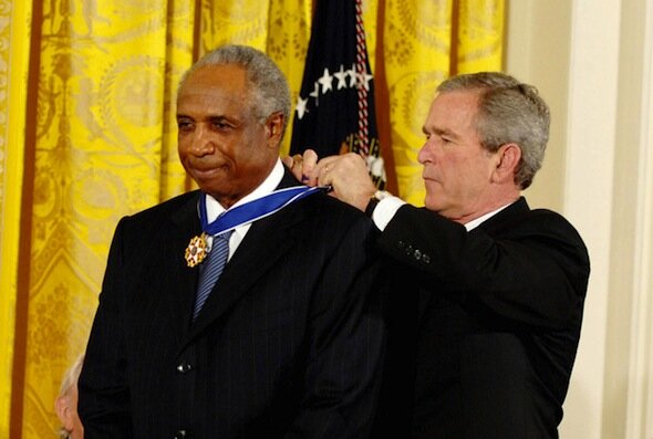 Frank Robinson receives the President's Medal of Freedom from President George W. Bush